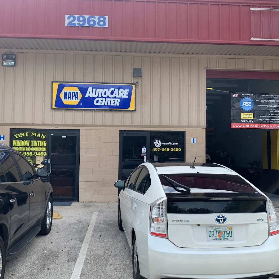 RepairTech Automotive NAPA AutoCare Center exterior with Toyota Prius in Kissimmee FL
